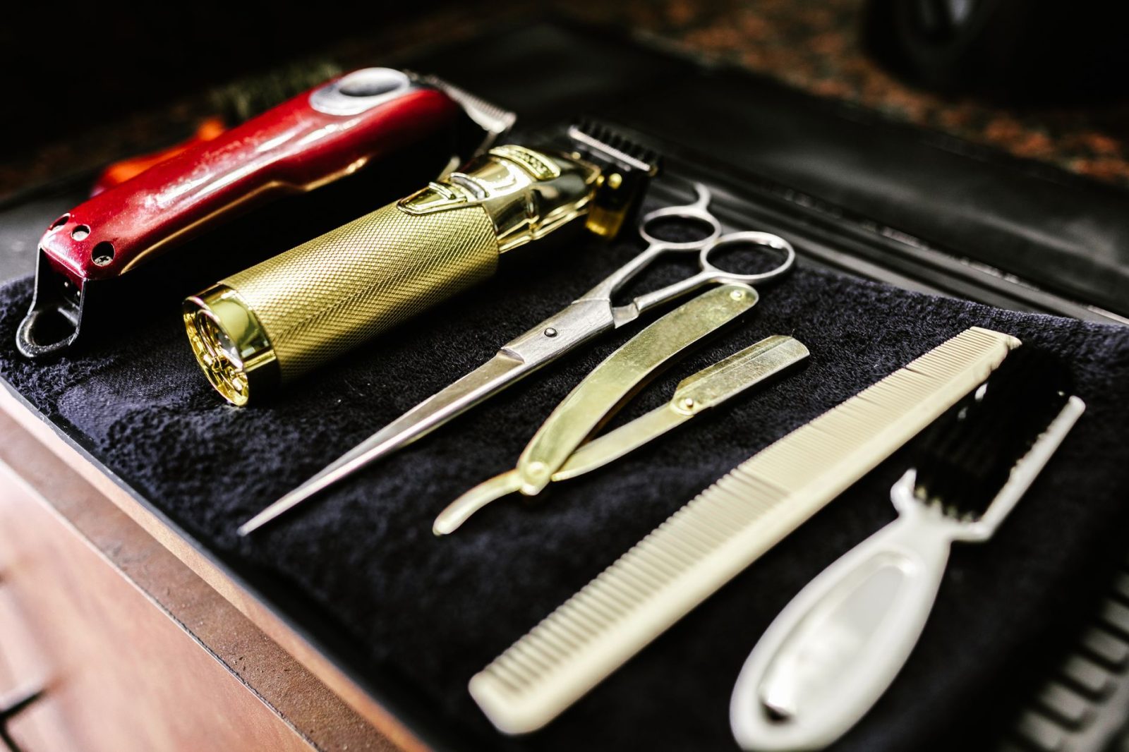 A collection of essential barbershop tools including trimmers, scissors and razors